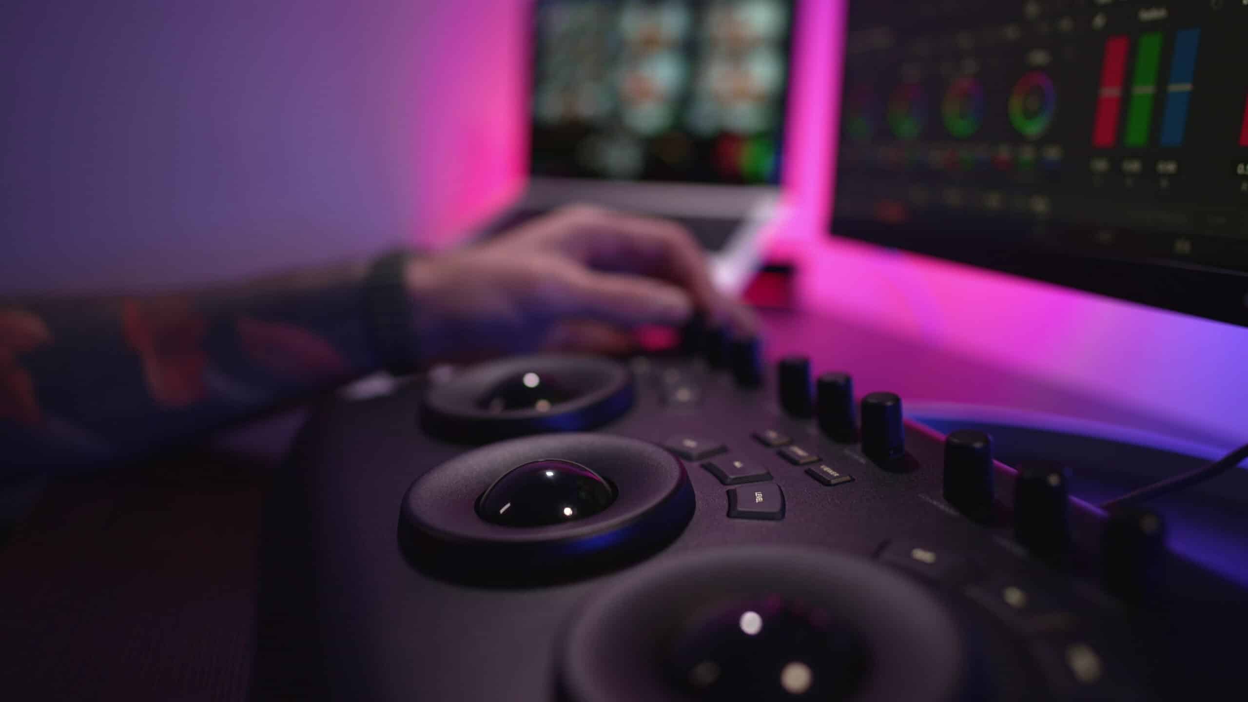 close up of a mans hand making edits on a special panel young man in glasses working o SBI 350790609